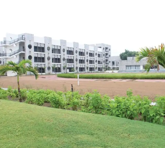 Campus building beside green lawns